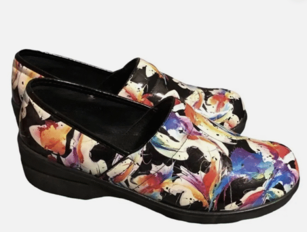 Colorful abstract pattern clog shoes with black sole, ideal for comfortable workwear fashion.